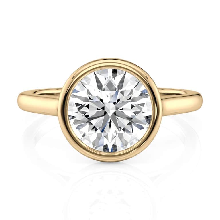 14k yellow gold round bezel solitaire with 14k yellow gold metal and round shape diamond