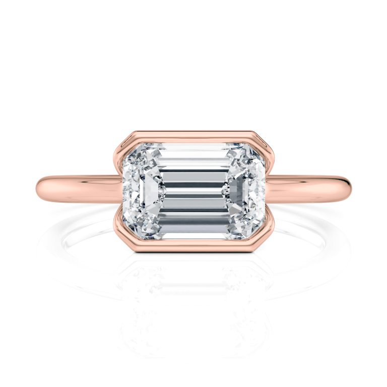14k rose gold e.w. half bezel emerald solitaire engagement ring with emerald shape diamond