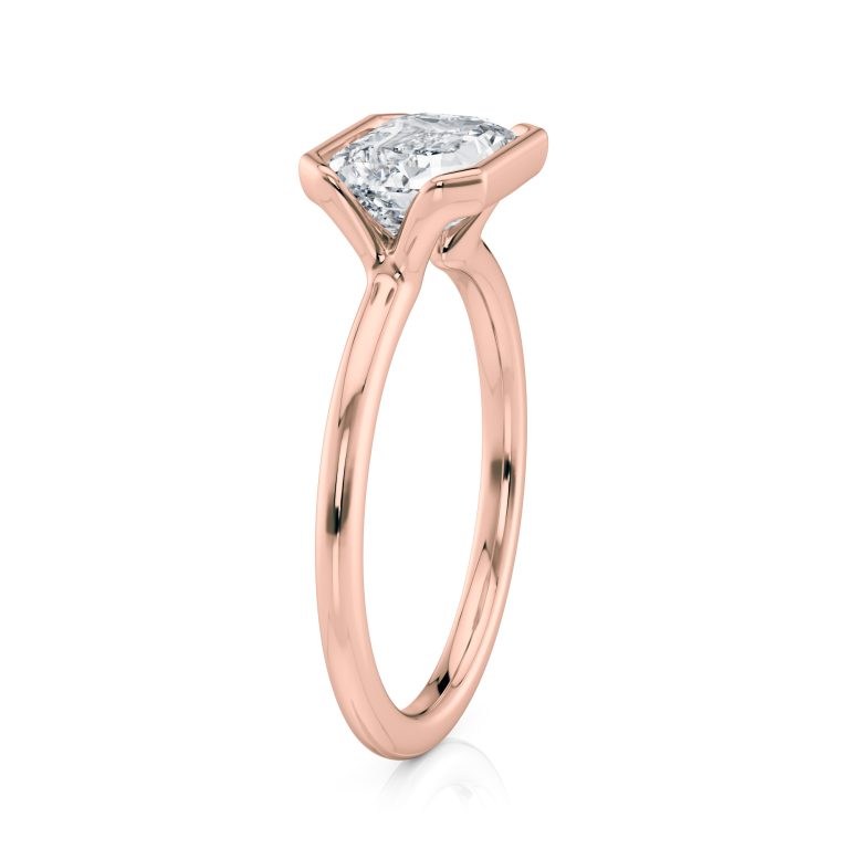 14k rose gold e.w. half bezel emerald solitaire engagement ring with emerald shape diamond