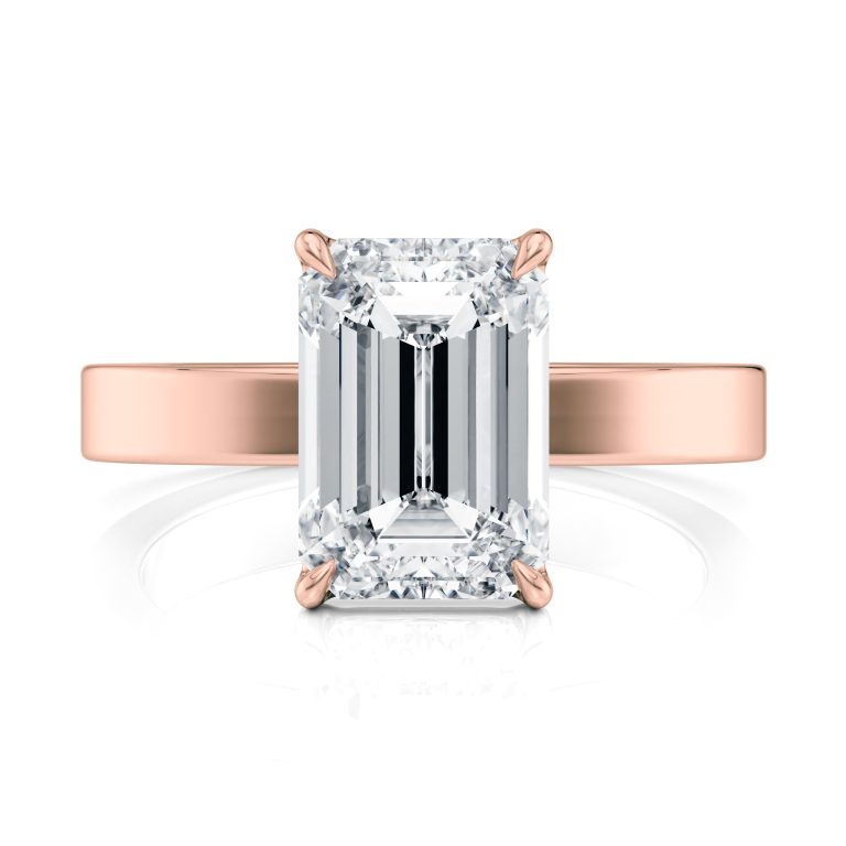 14k rose gold solitaire cigar band with emerald shape diamond