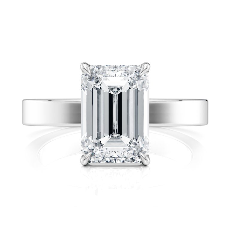 14k white gold solitaire cigar band with emerald shape diamond