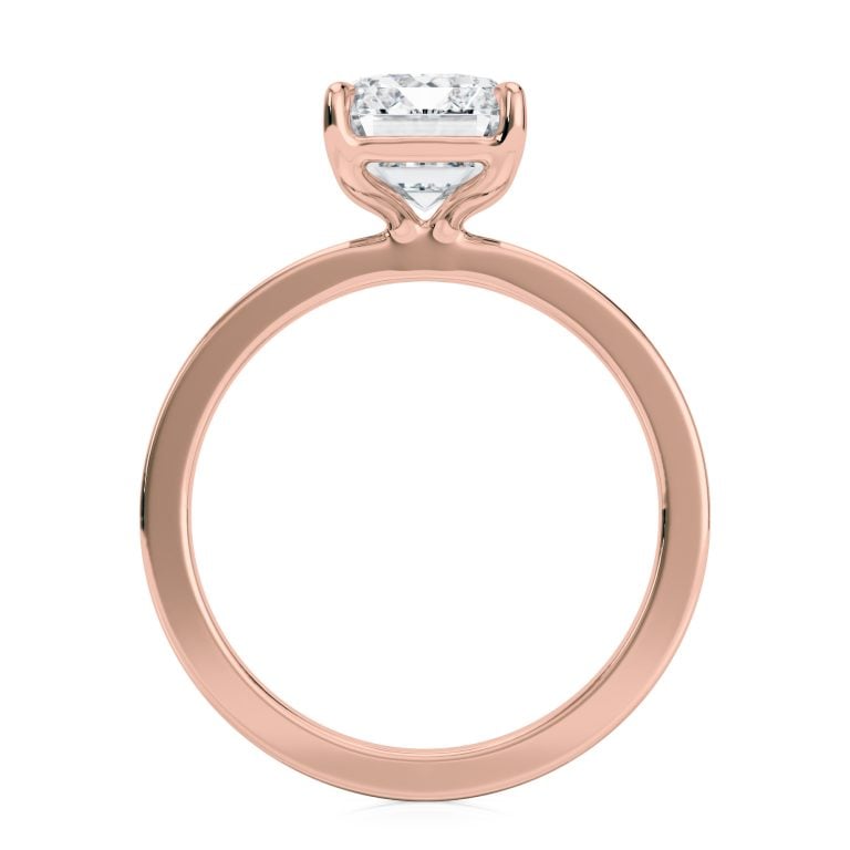 14k rose gold solitaire cigar band with emerald shape diamond