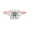 14k rose gold three stone pear lab diamond engagement ring-sits flush with a wedding band with round shape diamond