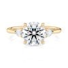 14k yellow gold three stone pear lab diamond engagement ring-sits flush with a wedding band with round shape diamond