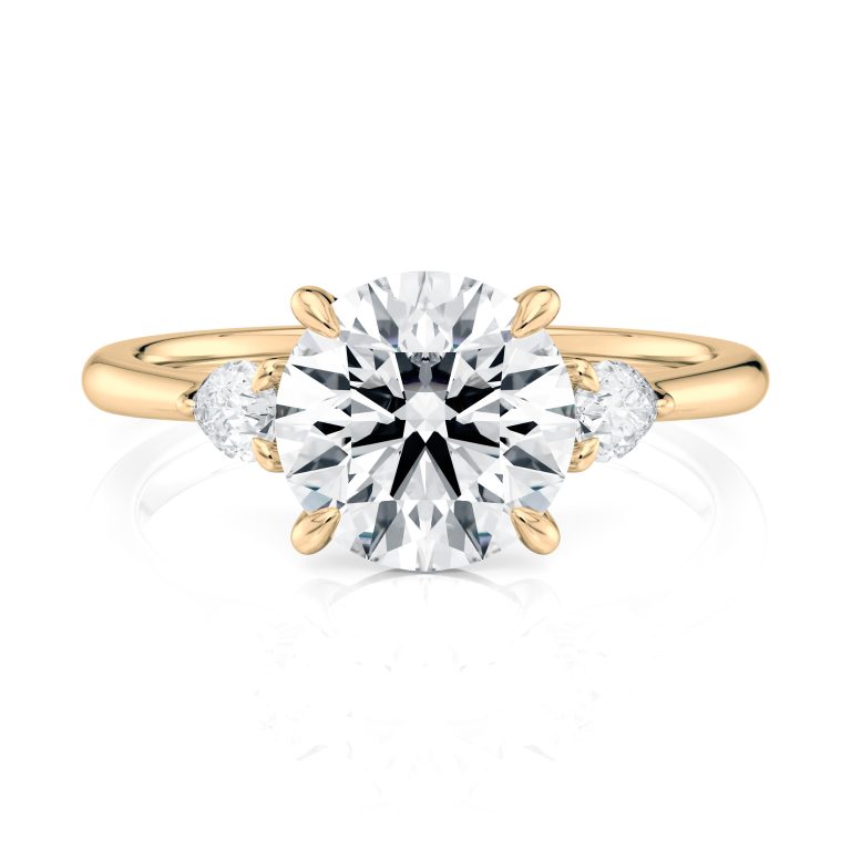 14k yellow gold three stone pear lab diamond engagement ring-sits flush with a wedding band with round shape diamond