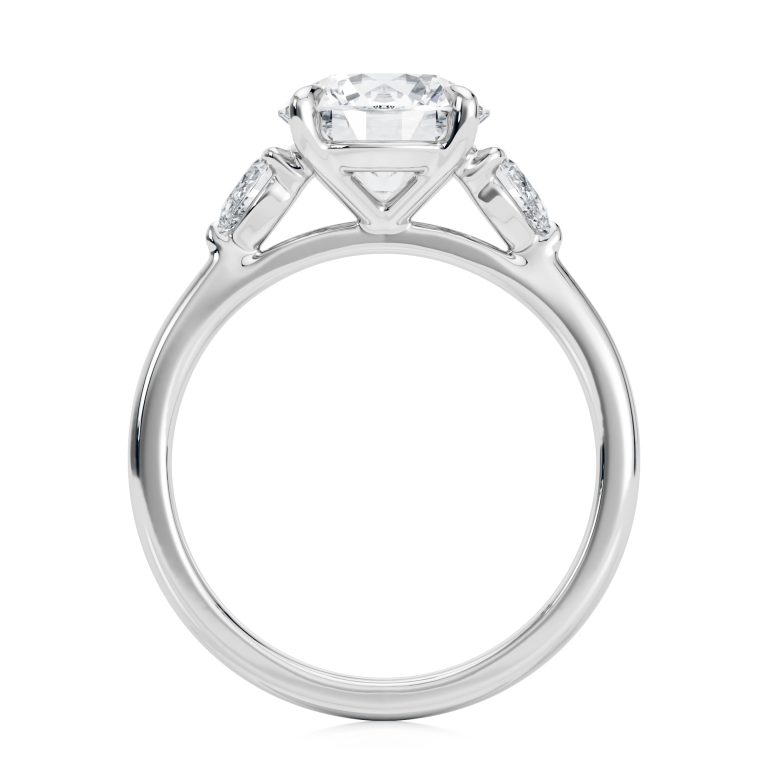 18k white gold three stone pear lab diamond engagement ring-sits flush with a wedding band with round shape diamond