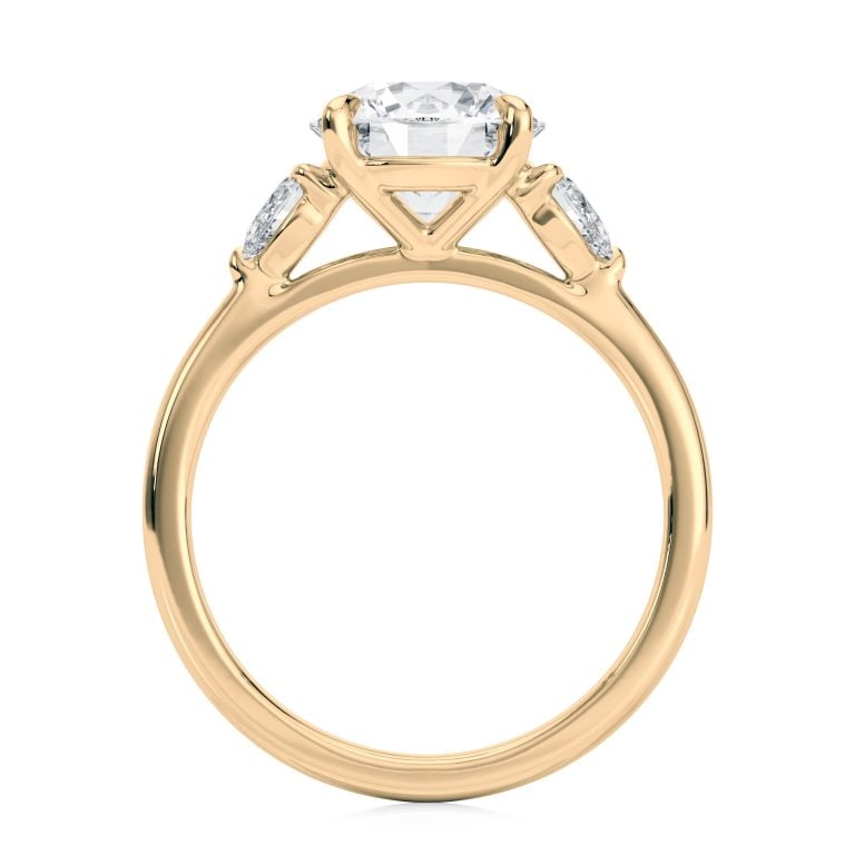 14k yellow gold three stone pear lab diamond engagement ring-sits flush with a wedding band with round shape diamond