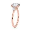 14k rose gold three stone pear lab diamond engagement ring-sits flush with a wedding band with round shape diamond