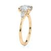 14k yellow gold three stone pear lab diamond engagement ring-sits flush with a wedding band with round shape diamond