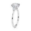 18k white gold three stone pear lab diamond engagement ring-sits flush with a wedding band with round shape diamond