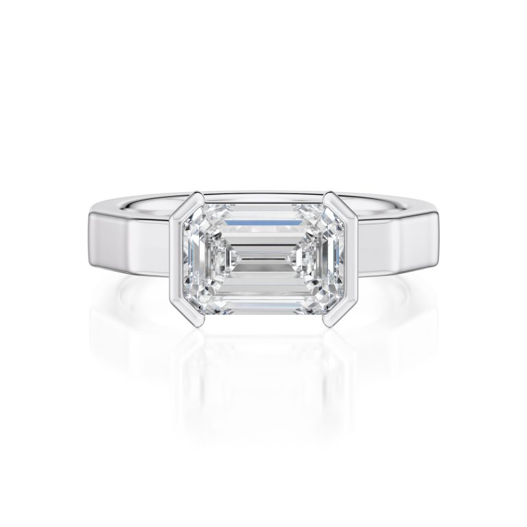 18k white gold e.w. geometric half bezel emerald solitaire engagement ring with emerald shape diamond