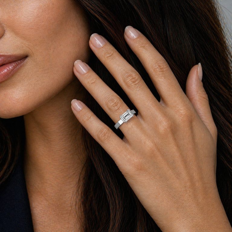 18k white gold e.w. geometric half bezel emerald solitaire engagement ring with emerald shape diamond