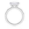 18k white gold e.w. geometric half bezel emerald solitaire engagement ring with emerald shape diamond
