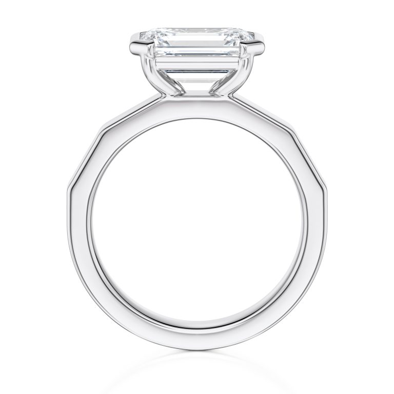 18k white gold e.w. geometric half bezel emerald solitaire engagement ring with emerald shape diamond