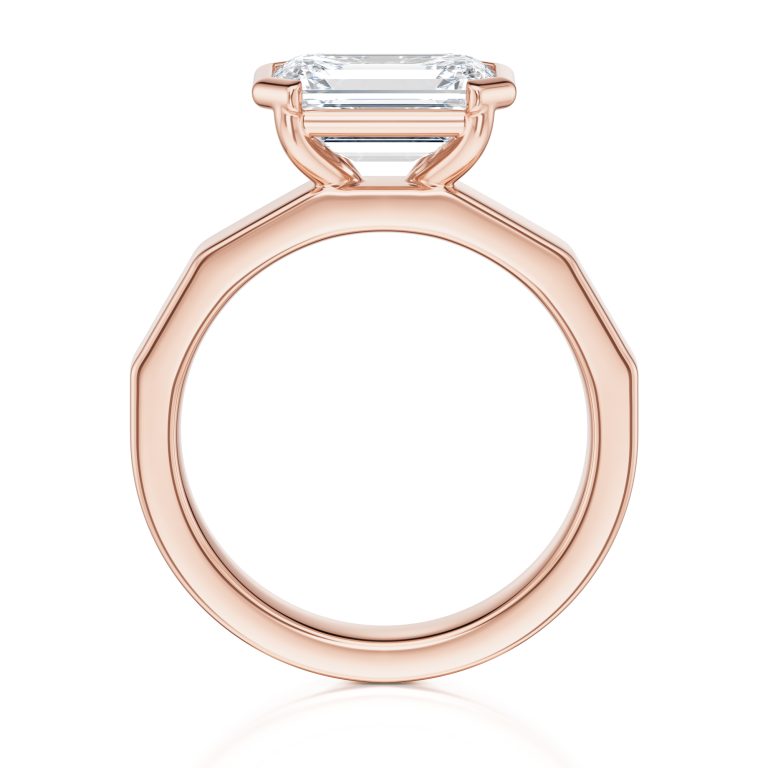 14k rose gold e.w. geometric half bezel emerald solitaire engagement ring with emerald shape diamond