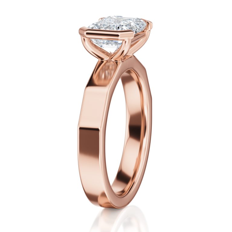 14k rose gold e.w. geometric half bezel emerald solitaire engagement ring with emerald shape diamond