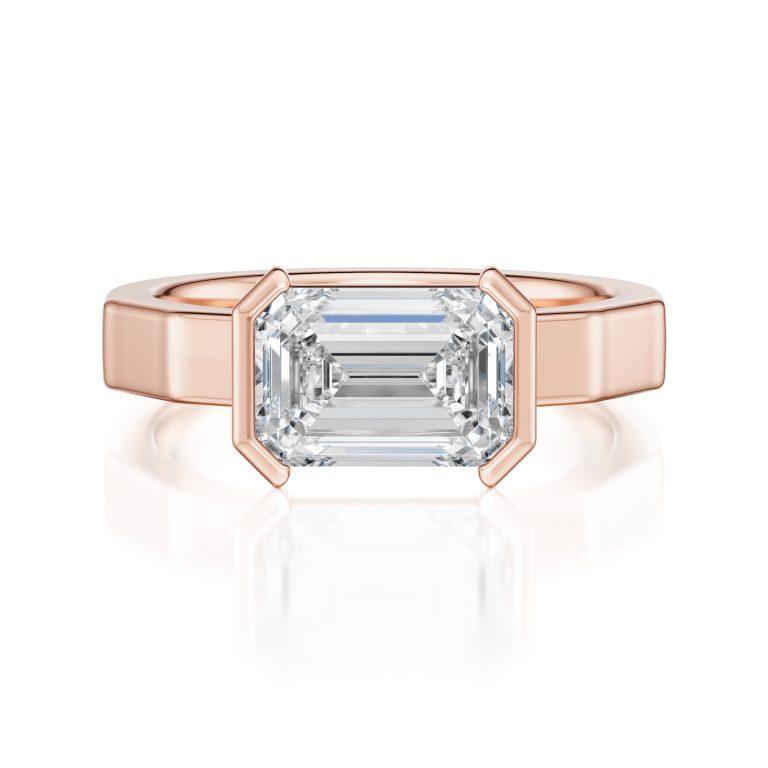 14k rose gold e.w. geometric half bezel emerald solitaire engagement ring with emerald shape diamond